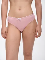 Colaless de algodón color rosa con ribete blanco y moño blanco de encaje en el frente.