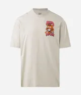 Remera de algodón color verde claro, de corte relajado, cuello redondo y manga corta. Presenta un estampado grande en la espalda de un tigre con ojos saltones y la frase "Acid Dreams" en tonos rosados y naranjas.