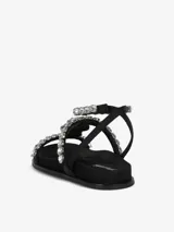 Sandalias negras con tiras adornadas con apliques brillantes y cierre con hebilla en el tobillo.