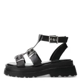 Sandalias tipo gladiadoras color negro, con diseño de plataforma chunky y suela dentada. Presentan múltiples tiras con hebillas metálicas ajustables en el empeine y el tobillo.