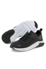 Championes deportivos Puma de color negro con suela blanca, diseño de malla transpirable y detalles en contraste.