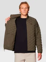 Campera técnica de plumón con diseño acolchado, cuello alto y cierre frontal completo. Confeccionada en tejido elástico con bolsillos laterales con cremallera y puños elásticos.