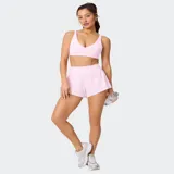 Short deportivo Fabletics modelo Sunchaser color azul, con cintura ancha de punto, short interior ajustado y detalle de logo reflectante.