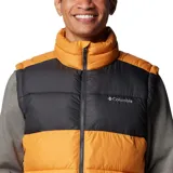 Chaleco acolchado Columbia con tecnología Omni-Heat termorreflectante. Presenta un diseño bicolor en bloques de color naranja y negro, con cierre frontal completo, cuello alto y bolsillos laterales con cremallera.