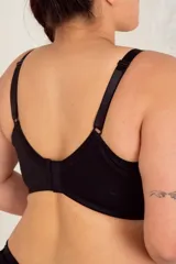 Corset corto negro con aro, confeccionado en puntilla elastizada con detalles de transparencia en microtul, breteles anchos regulables y broches reforzados regulables en espalda.