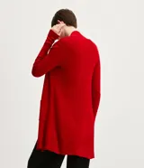 Cardigan largo de punto abierto, con mangas largas y bolsillos frontales aplicados. Diseño minimalista y versátil de la marca Cortelle.