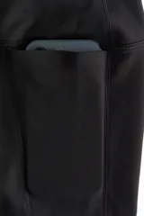 Leggings deportivas de talle alto en color negro, confeccionadas en tejido funcional SoftMove con tecnología DryMove. Presentan cintura ancha y bolsillos abiertos laterales en cada pierna.