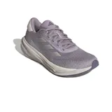 Championes de running Adidas Supernova Stride, color lila con detalles plateados y suela blanca.
