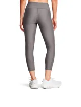 Leggings deportivos Under Armour HeatGear de talle alto en color gris melange, con diseño ajustado, costuras planas ergonómicas, bolsillos laterales y el logo de la marca en el lateral de la pierna.
