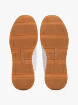 Zapatillas Tommy Hilfiger blancas con detalles en azul, rojo y suela color caramelo.