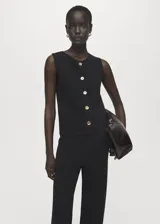 Pantalón de punto fino negro, de tiro medio y diseño recto con cintura elástica sin cierre.