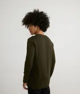 Buzo negro de algodón con cuello redondo y mangas largas.