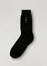 Medias de caña alta color marrón con diseño de rombos en la parte superior. Confeccionadas en algodón, poliéster y elastano.