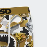 Calzoncillos bóxer de hombre con estampado de camuflaje en tonos blanco, negro, gris y dorado. Presenta diamantes dorados y plateados estampados y una boca de tiburón dorada y negra en el frente. Cintura elástica dorada con logo PSD en negro.