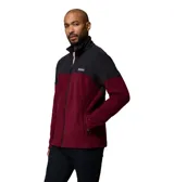 Campera polar Columbia con cierre frontal completo y cuello alto. Presenta un diseño de bloques de color con la parte superior en negro y la inferior en bordó, incluyendo bolsillos laterales con cierre y logo de la marca en el pecho.