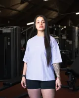 Remera negra de algodón, corte oversize, con inscripción 'GAINS.' en el frente.