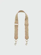 Correa para cartera Marc Jacobs, modelo The Monogram Utility Webbing Strap, confeccionada en cinta tejida con diseño de monograma de la marca en color beige y tostado, con detalles en cuero y herrajes metálicos dorados.