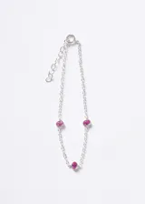 Pulsera de cadena forcé en plata 925 con tres puntos de luz ovalados engastados con zirconias color fucsia.