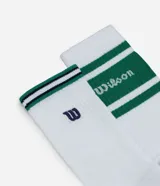 Pack de dos pares de medias deportivas blancas de caña larga, con franjas horizontales verdes y detalles en azul marino en el borde superior. Una de las medias presenta el logo "Wilson" bordado en verde en la caña.