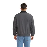 Campera Quiksilver modelo Milo de corte bomber, color gris con textura micro-cuadros, cuello camisero en contraste negro, cierre frontal completo y puños elásticos.