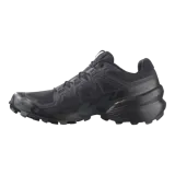 Championes Salomon Speedcross 6 de color negro, diseñados específicamente para trail running. Presentan una estructura robusta y técnica, capellada sintética y textil con refuerzos termosellados, sistema de cordones de ajuste rápido Quicklace y suela con tacos profundos para máxima tracción en terrenos difíciles.