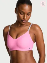 Sujetador inalámbrico ligeramente forrado de color rosado, con escote pronunciado, tirantes ajustables con logo y microfibra suave.