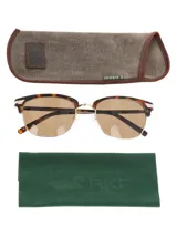 Lentes de sol RKF modelo Positano, con armazón estilo clubmaster de acetato con estampado carey y detalles metálicos dorados, y cristales polarizados color marrón.
