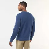 Sweater de punto fino con cuello redondo, diseño liso y mangas largas con puños acanalados.