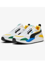 Championes deportivos Puma X-Ray en combinación de azul, gris y negro, con detalles en amarillo flúor y suela blanca y azul.