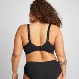 Sujetador corbeille negro de microfibra acanalada con breteles regulables y cierre frontal con botones.