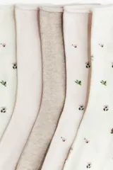 Pack de cinco pares de medias de algodón con borde enrollado, que incluye diseños lisos en tonos neutros y diseños con estampado floral.