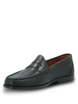 Mocasines de cuero negro con diseño clásico tipo penny loafer, con costuras reforzadas en el empeine y suela mixta de cuero y goma.