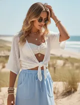 Skort azul de algodón con pretina elastizada, lazo de ajuste, bolsillos laterales verticales y short interno.