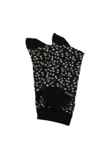 Medias de largo medio color negro con estampado floral en tonos celestes y rosados, con puntera y talón reforzados.