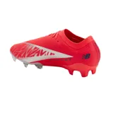 Championes de fútbol New Balance Furon Elite V8, color coral con detalles plateados y logo azul marino.