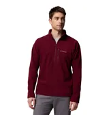 Buzo polar de hombre con cierre frontal parcial y cuello alto. Presenta un bolsillo vertical con cierre en el pecho y el logo de la marca bordado. Confeccionado en tejido polar suave, ideal para actividades al aire libre.