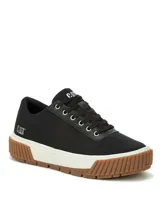 Sneakers Caterpillar modelo Amp Canvas, de color negro con suela de plataforma blanca y base de goma marrón. Capellada de lona con detalles de poliuretano, cordones negros y ojalillos metálicos. Presenta la inscripción de la marca en la lengüeta y en el lateral del talón.