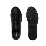 Championes urbanos de cuero negro con logo de cocodrilo verde bordado en el lateral.