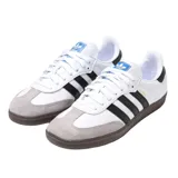 Championes Adidas Samba OG blancos con tres tiras negras a los costados y suela marrón de goma.