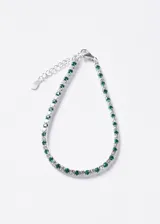 Pulsera de plata 925 estilo tennis, decorada con una alternancia de zirconias transparentes y zirconias de color verde, con cierre de mosquetón y cadena de alargue.