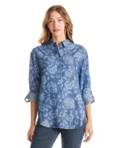 Camisa de lyocell con estampado floral en tonos azules, cuello con solapa, cierre frontal con botones y mangas largas regulables con presilla.