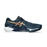 Championes de tenis Asics Gel Resolution 9 Clay, color azul marino con detalles en cobre y blanco. Diseñados con tecnología Dynawall para mayor estabilidad y soporte en canchas de polvo de ladrillo.