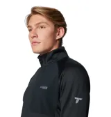 Campera polar Columbia Titanium modelo Triple Canyon G Ii, de color negro, con cuello alto, cierre frontal completo y bolsillos con cremallera. Cuenta con tecnología Omni-Wick para control de humedad, costuras planas y orificios para los pulgares en los puños.