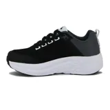 Championes deportivos Diadora modelo Bresh, color negro con detalles en gris y blanco. Presentan una capellada de malla transpirable, refuerzos sintéticos oscuros y una suela gruesa de espuma blanca con diseño esculpido.