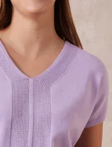 Buzo tejido color blanco, marca Ninety. Escote en V. Calado en escote y delantera.