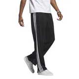 Pantalón negro de Adidas, modelo Firebird, con tres rayas blancas a los costados y logo bordado en el muslo.