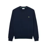 Buzo Lacoste de cuello redondo, confeccionado en algodón, con diseño liso y el icónico logo de cocodrilo bordado en el pecho.