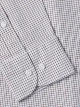 Camisa de vestir Tommy Hilfiger de corte clásico, confeccionada en tejido Oxford de algodón regenerativo con estampado a cuadros Tattersall en tonos blanco, azul y gris. Tiene cuello abotonado, cierre con botones, manga larga y logo bordado en el pecho.