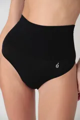 Colaless negro de microfibra sin costuras, con tiro alto y faja en la cintura.
