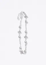 Pulsera de plata 925 con diseño de cadena decorada con dijes en forma de flores de zirconias y piedras de luz intercaladas. Incluye cadena de extensión.